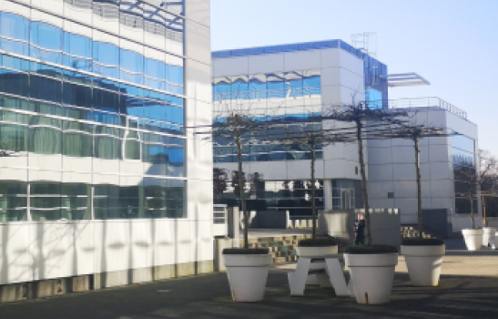 Exterior view of Fujitsu's offices in Capellen, Luxembourg, showcasing modernity and innovation