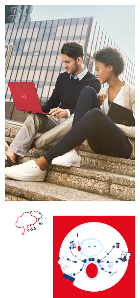 Young woman and young man smiling, collaborating on a red Fujitsu computer in front of office buildings